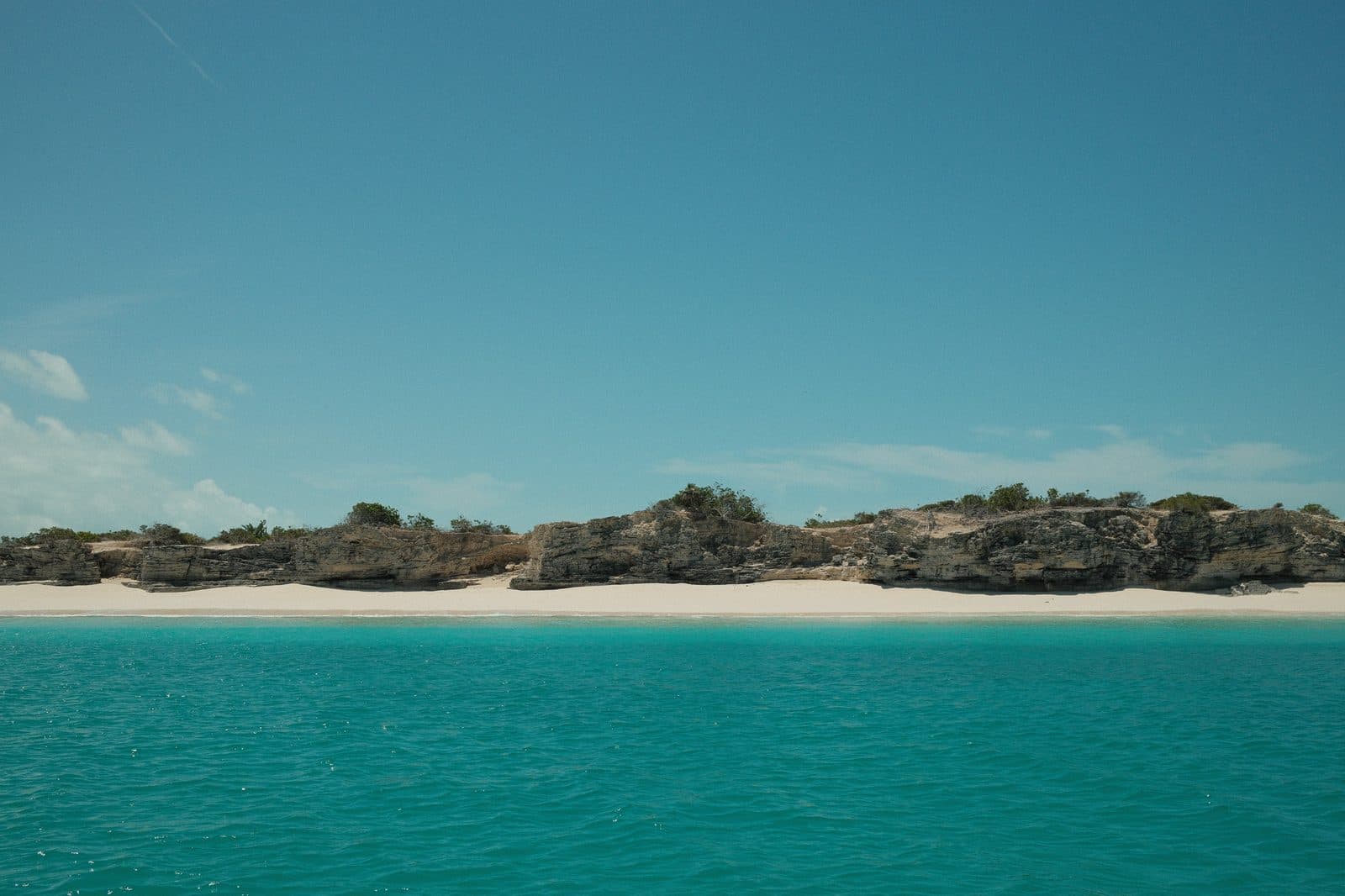 Shoreline, sand and turquoise water
