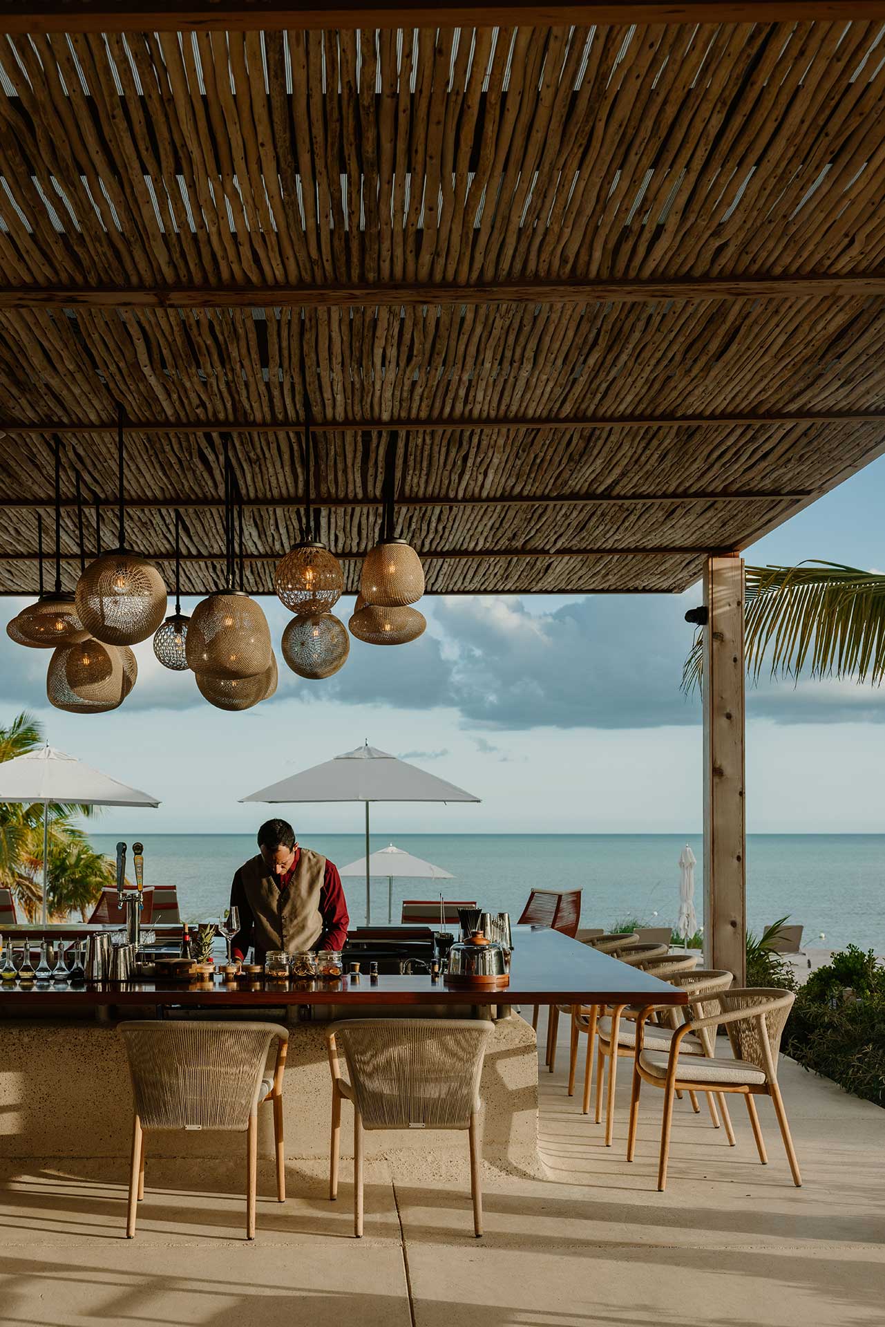 ÁMBRA beach club on Long Bay, looking out to turquoise water